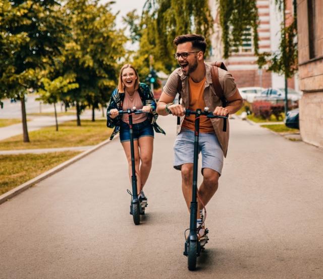 young adults on scooters