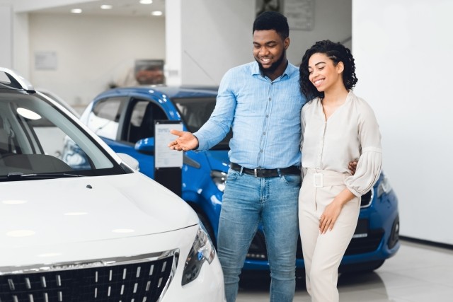 Couple looking at car