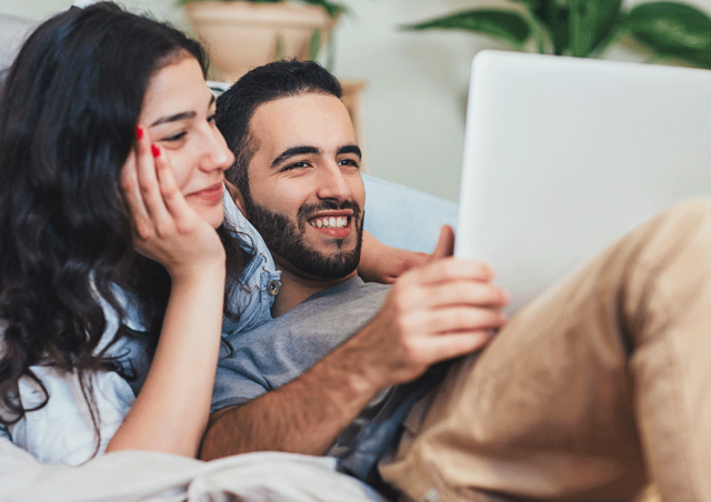 Couple looking at laptop