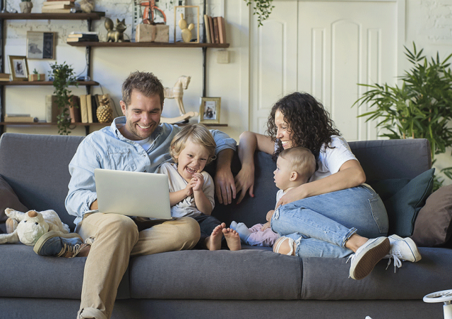 Family on couch with kids