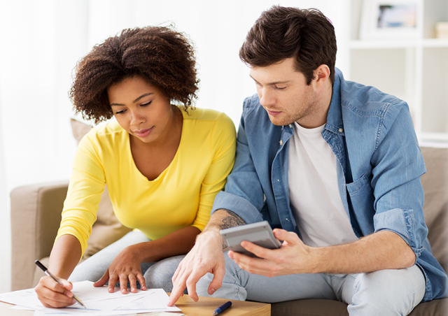 Man and woman budgeting