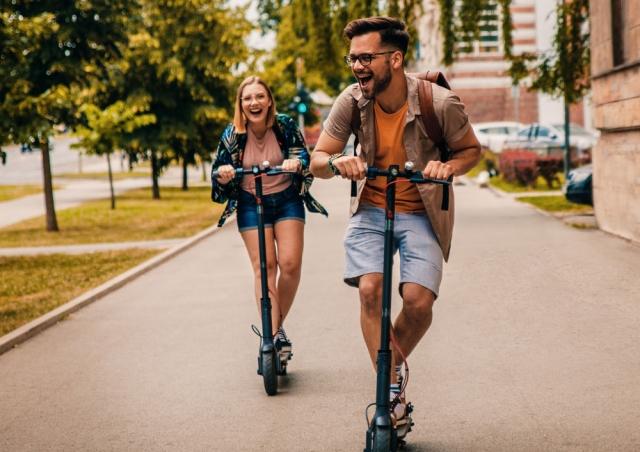 young adults on scooters