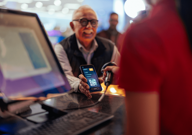 Man scanning a digital ticket at an event